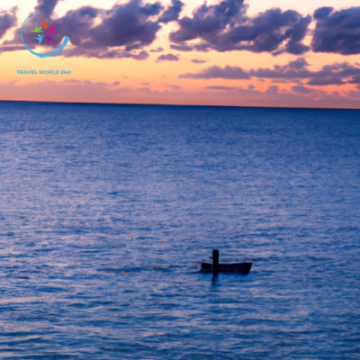 the vibrant hues of the Bahamian sunrise reflected on calm turquoise waters