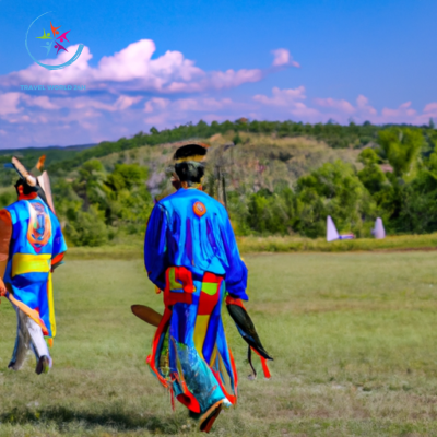 the essence of Native American Reservations in the USA through an image that conveys the vibrant colors of traditional powwow regalia, the intricate beadwork, and the rhythmic movements of dancers, all against a breathtaking backdrop of majestic landscapes
